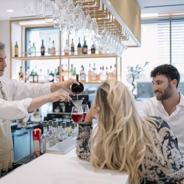 Ethereal White Resort Heraklion visitors being served at the lobby bar