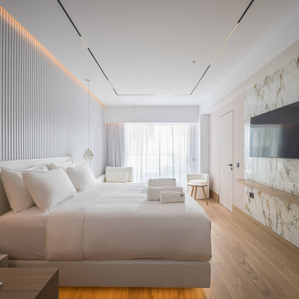 Ethereal White Resort Heraklion Deluxe Suite room, double bed and amenities