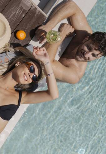 Ethereal White Resort Heraklion guests enjoying a sunny day at the pool